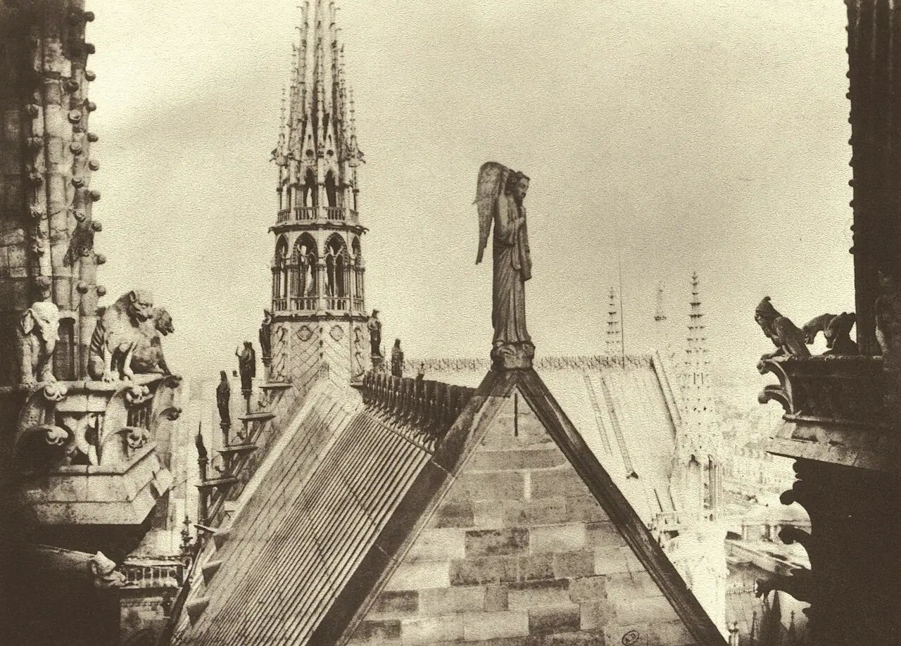 Viollet-le-Duc's new spire and the roof statues, photographed by Charles Marville, 1865.