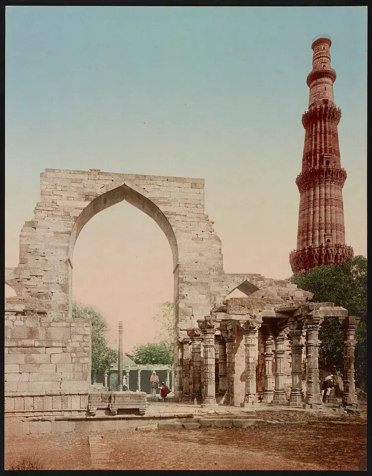 The minar and the arches of the Quwwat-ul-Islam mosque in a photochrom print of about 1890.